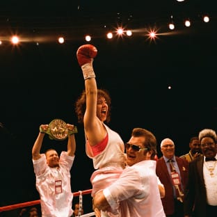 A female boxer punching the air