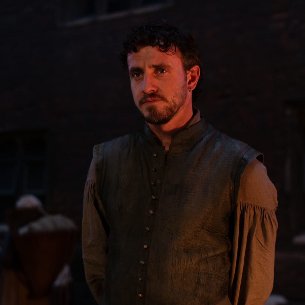 Man lit by orange light