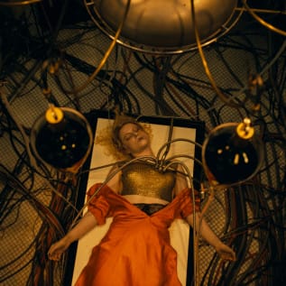 A woman on an operating table with tubes attached to her
