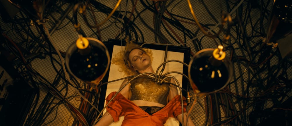 A woman on an operating table with tubes attached to her