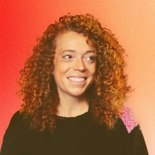 Woman with curly hair smiling