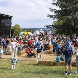 Group of people watching outdoor performance